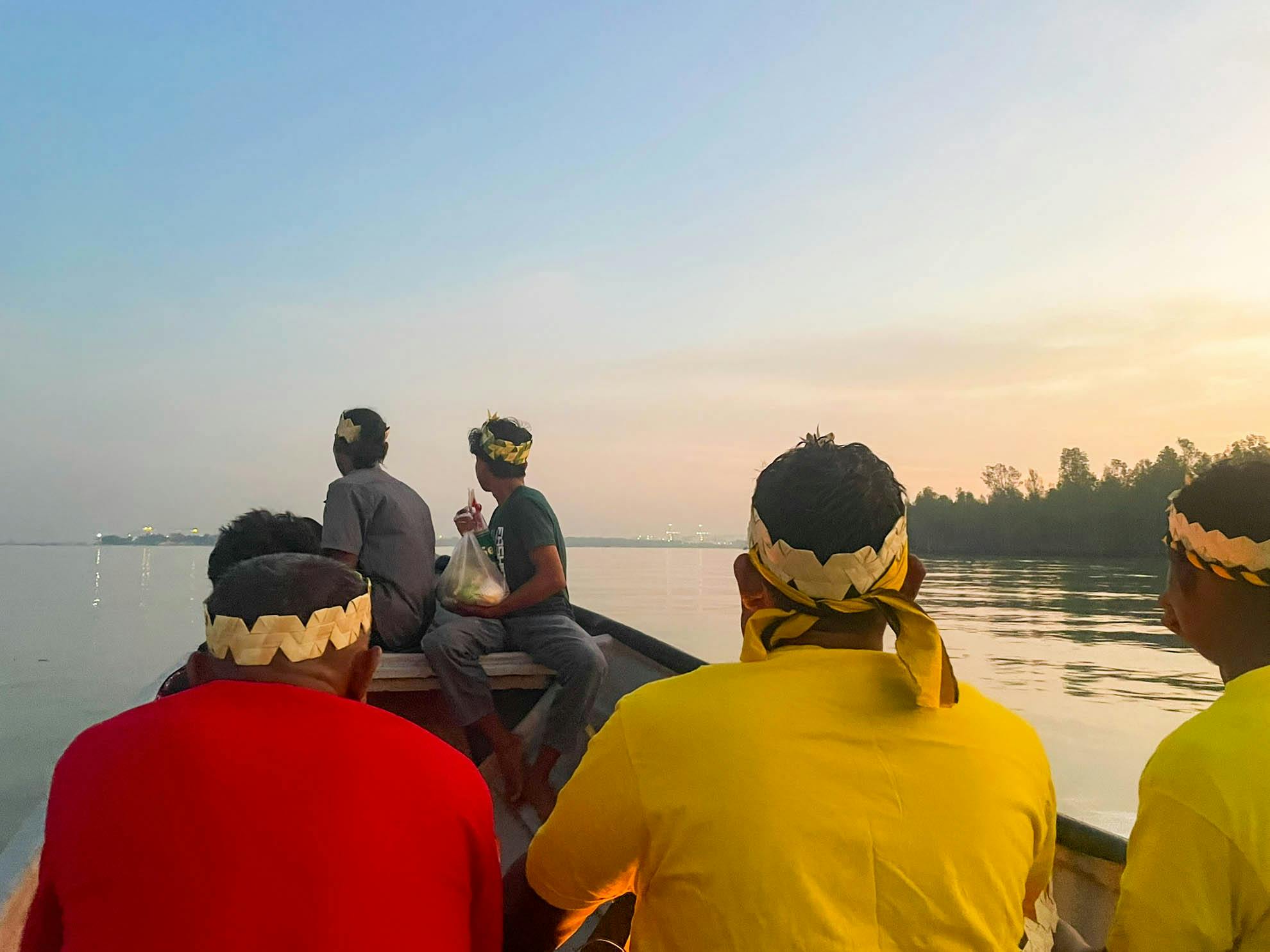 Mah Meri villagers look towards Port Klang as they travel to their shrine off the coast of Carey Island on Hari Moyang, meaning Ancestors' Day. Image: Samantha Ho