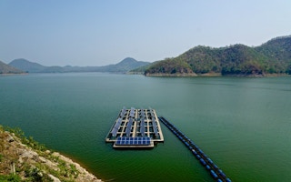 array of solar panels on Srinakarin Lake in Kanchanaburi Province, Thailand