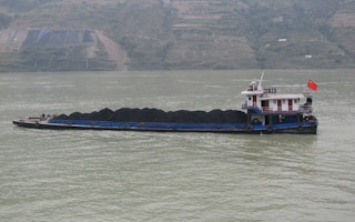 A coal barge along a river in China.