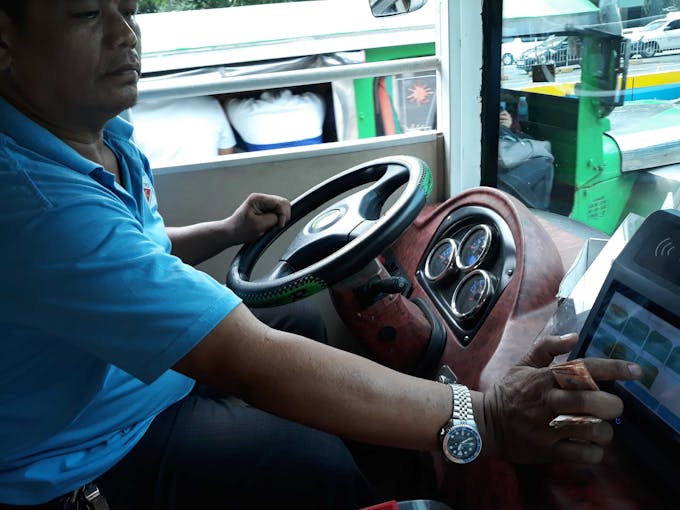 electric jeepney paying fare