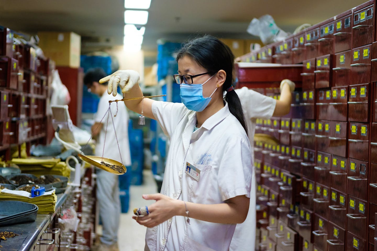 apothecary mixing traditional Chinese medicine