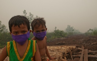 children masks air pollution indonesia