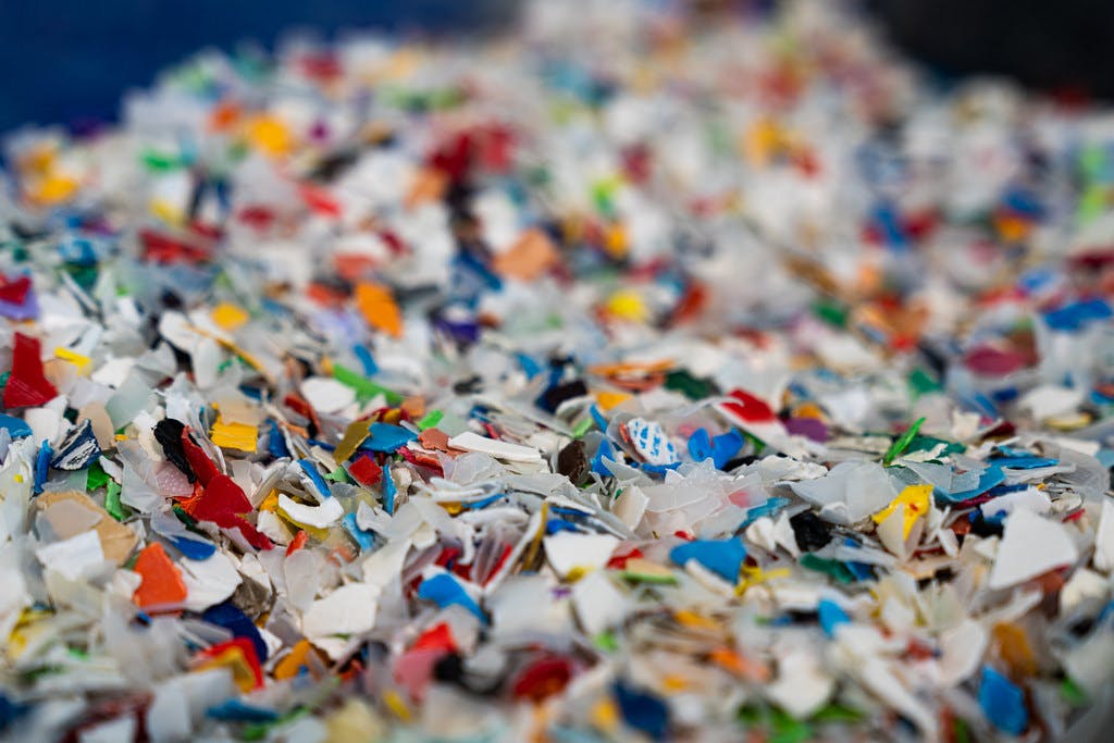 Shredded recycled plastic pieces