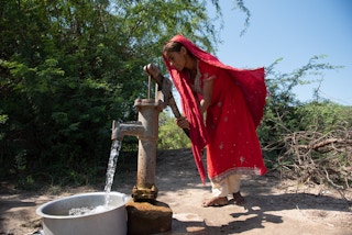 Woman fetching water in Pakistan