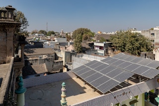 India solar panels on top of house