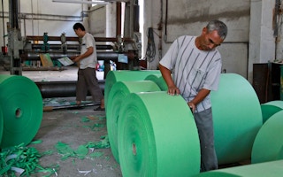 Workers in a waste paper processing factory in Uzbekistan