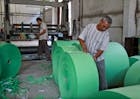 Workers in a waste paper processing factory in Uzbekistan