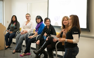 Women on a panel on women in tech