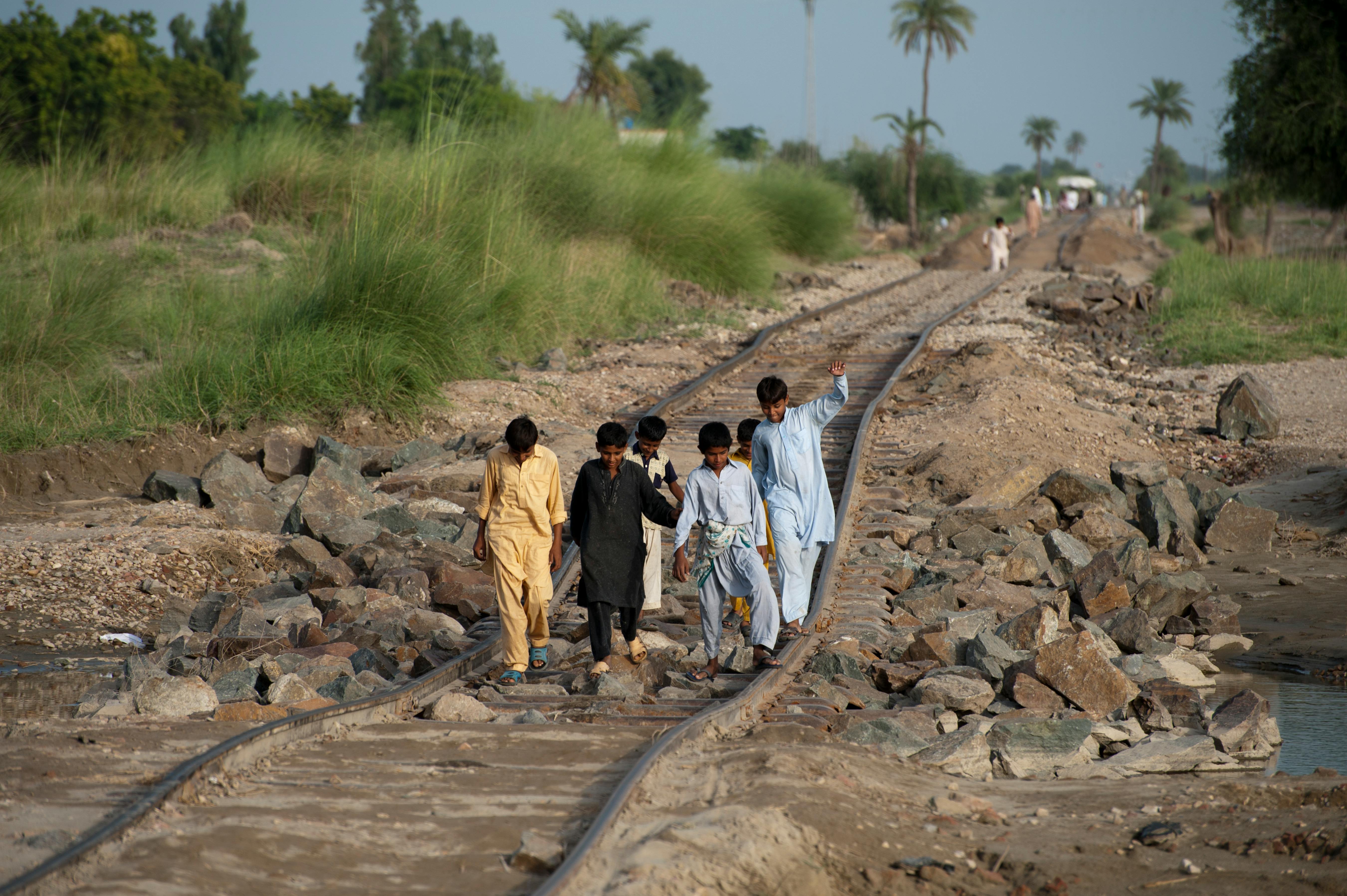 Children on railway damaged by Pakistan floods 2010