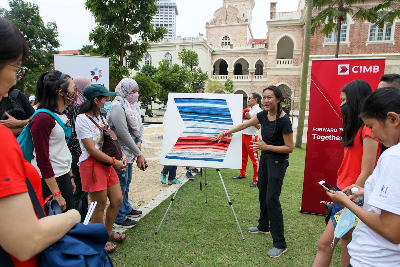 Luanne Sieh, CIMB's head of sustainability, explaining the 'warming stripe' history of global warming.
