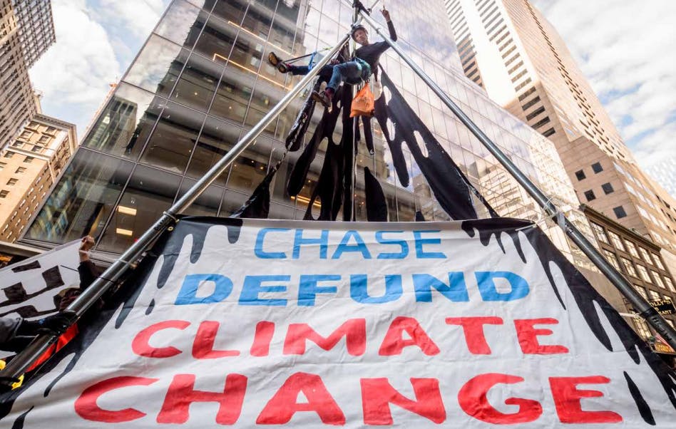 An activist protesting against JP Morgan Chase's fossil fuel financing in the United States.