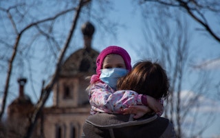 child and parent wearing masks