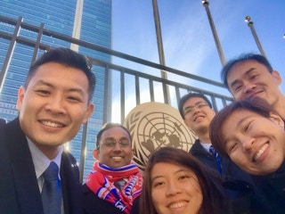 David Chua (left) with youth delegates at the United Nations