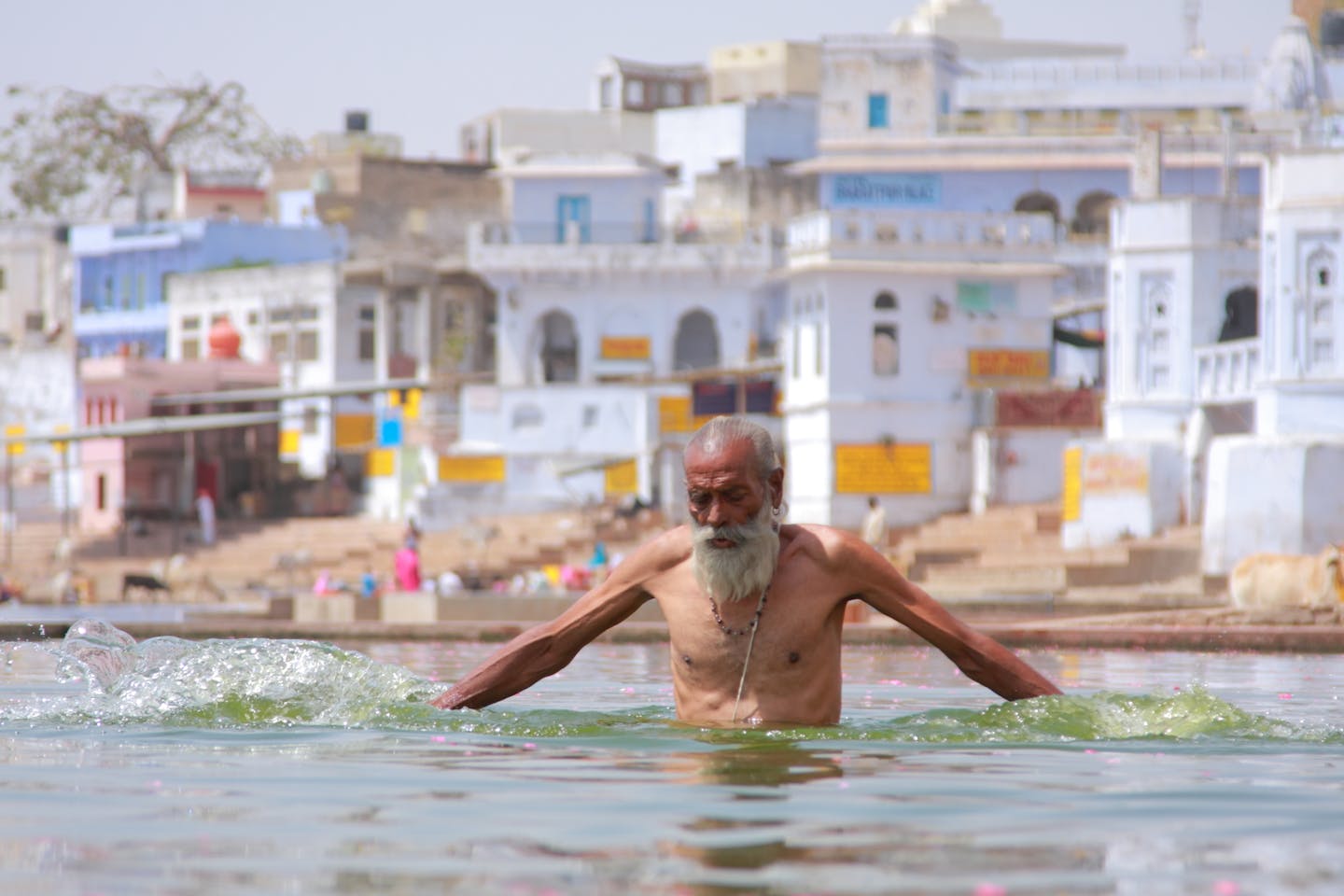 indian man bathing on a hot day