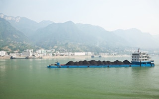 Coal barge sailing along the Yangtze river in China