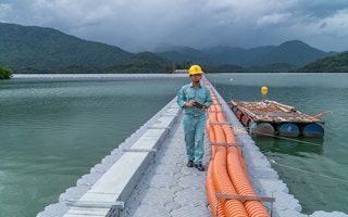 worker floating solar energy project