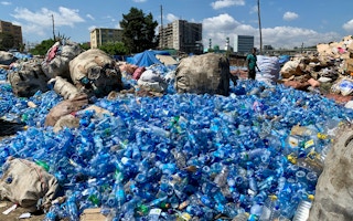 Plastic water bottles await collection for recycling in Africa.
