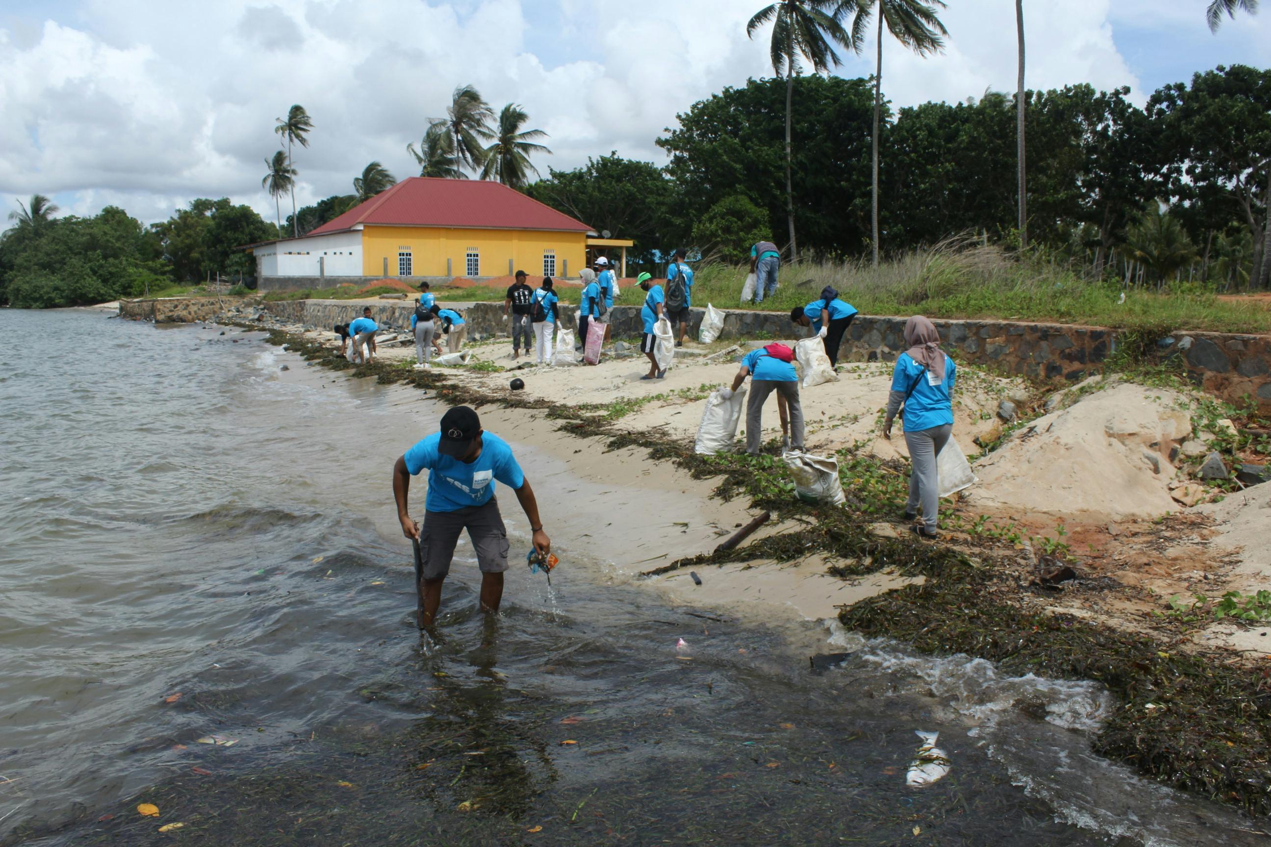 Hospitality workers clean beaches off the coast of Bintan.