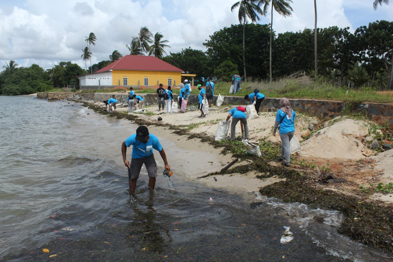Hospitality workers clean beaches off the coast of Bintan.