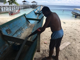 Boat maintenance by local in Papua  