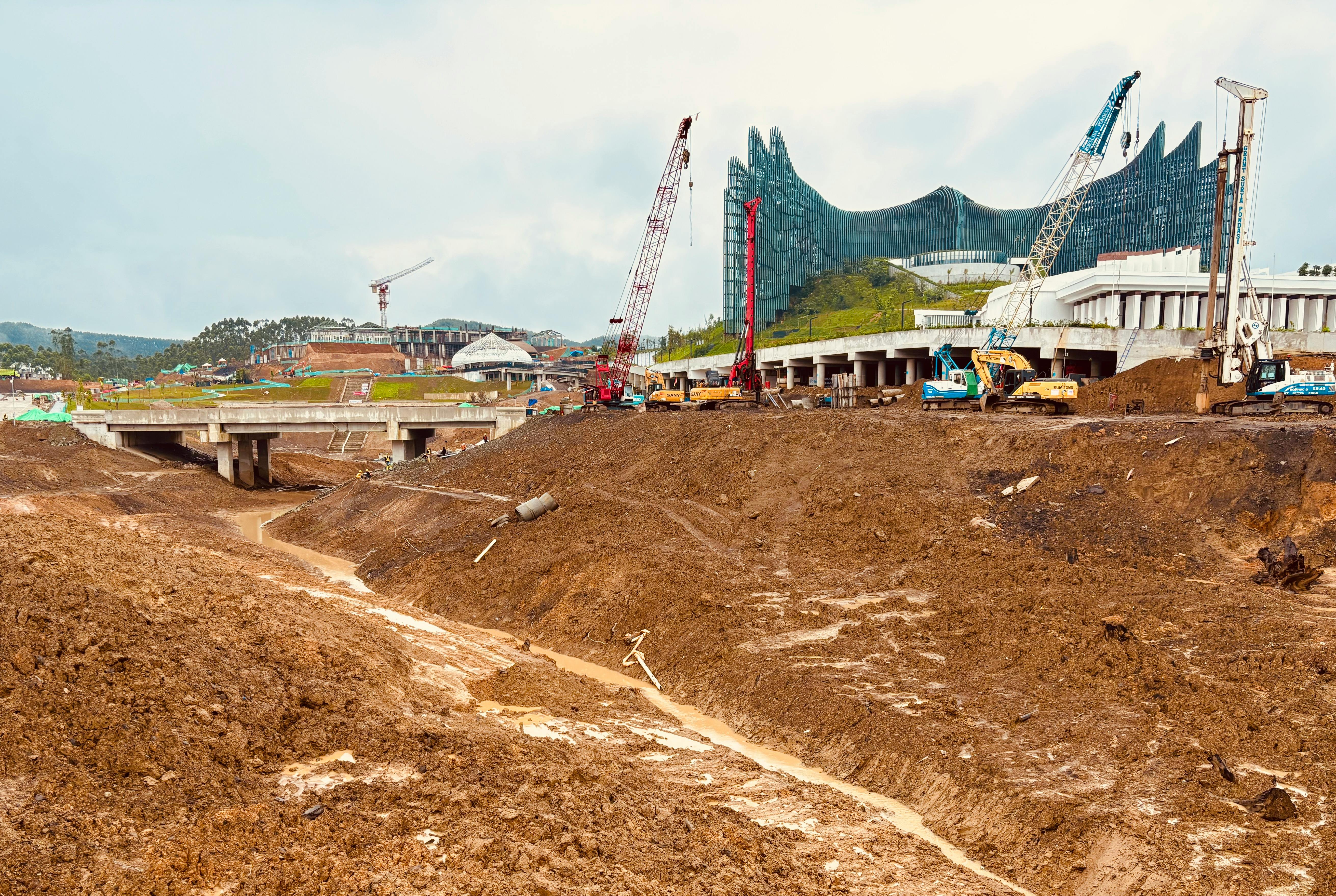 A large expanse of mud lies before the under-construction palace in Indonesia's new capital Ibu Kota Nusantara, in East Kalimantan.