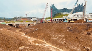 A large expanse of mud lies before the under-construction palace in Indonesia's new capital Ibu Kota Nusantara, in East Kalimantan.