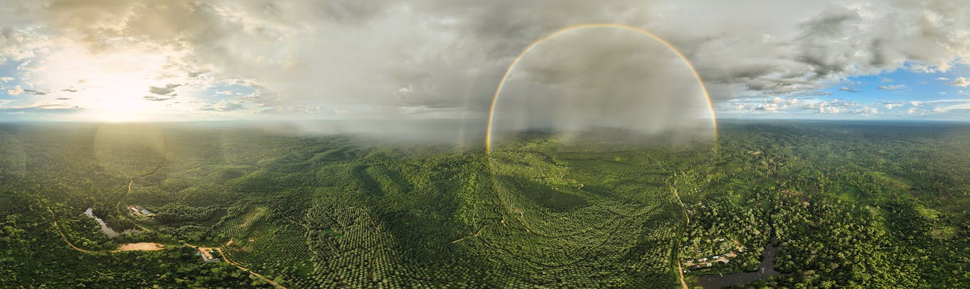 A landscape in Jambi, Sumatra, Indonesia, taken via drone in a rainbow.