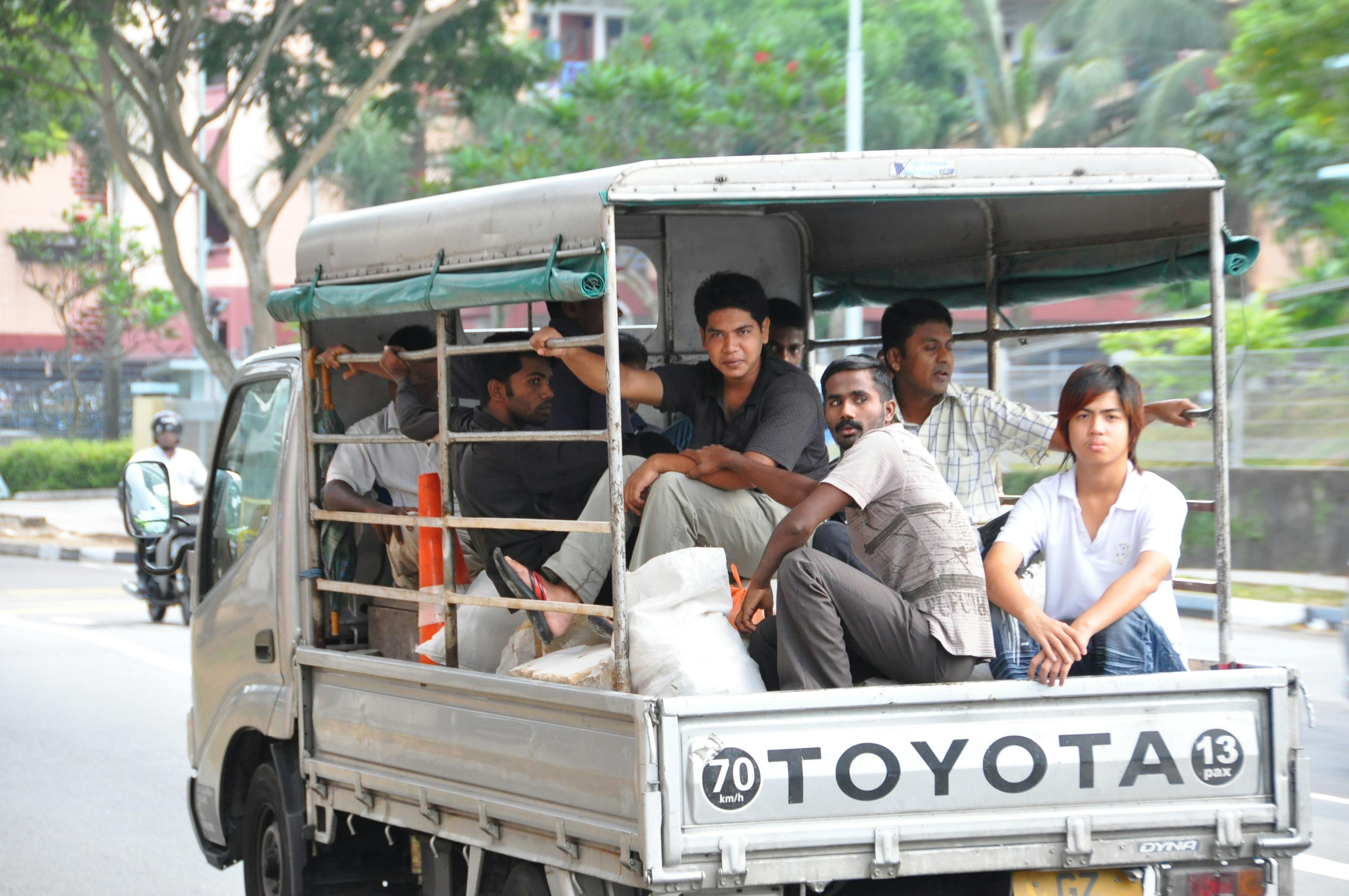 Workers in lorries in Singapore