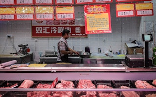 Market selling pork in China