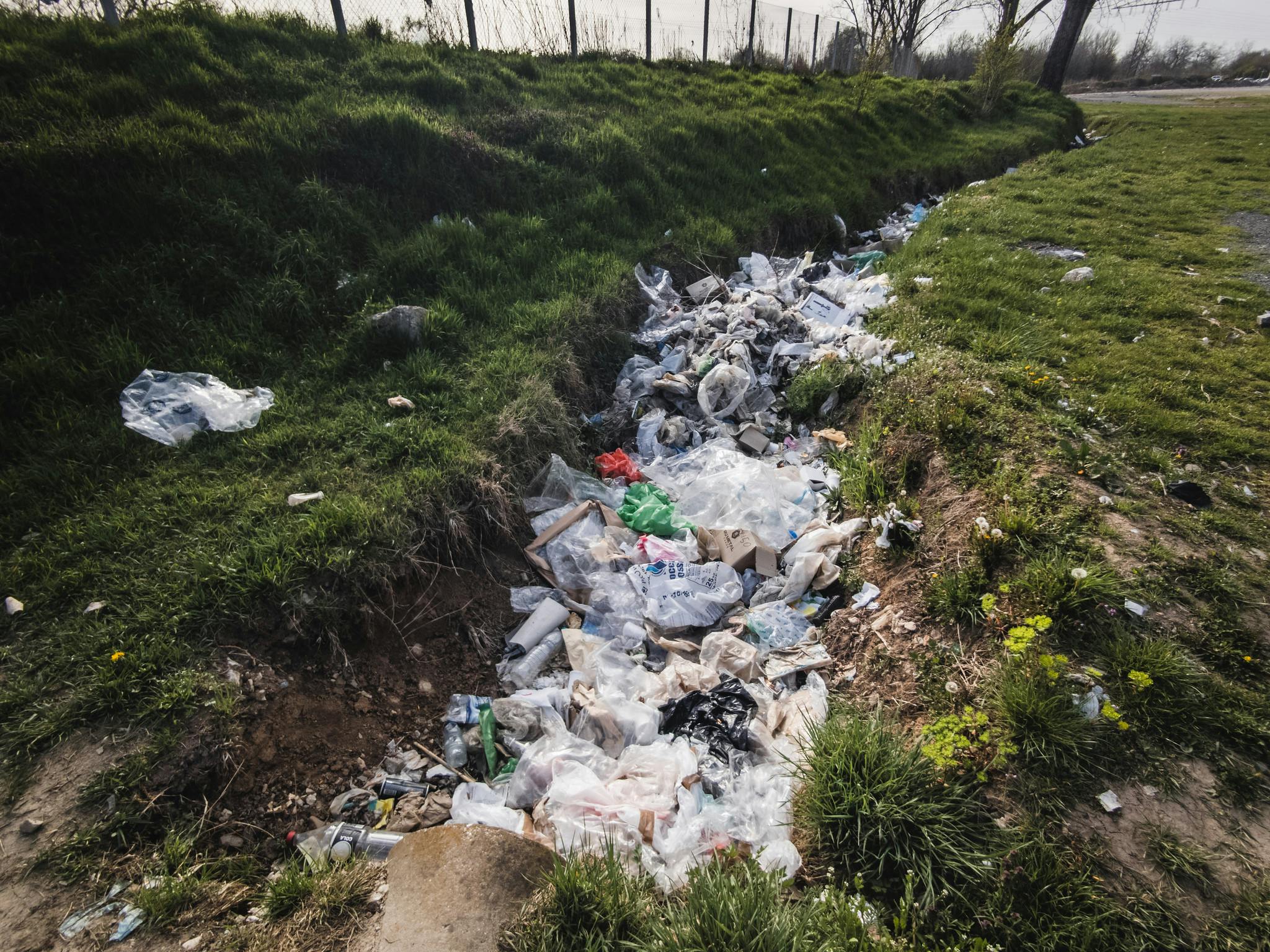 Drainage channel filled with trash