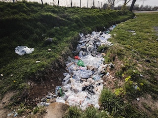 Drainage channel filled with trash