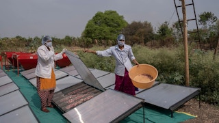 Farmers using solar conduction dryer S4S Technologies Earthshot Prize