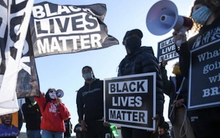 Black Lives Matter demonstrators hold signs during a march in St Paul, Minnesota, US.