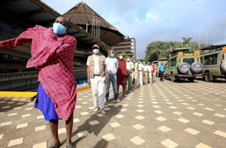 queue to receive the AstraZeneca/Oxford vaccine Kenya