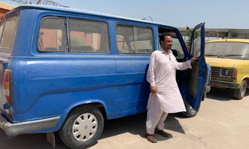 In Pakistan city, green scheme for polluting bus owners inches along