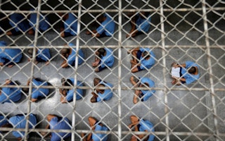 Inmates sit on the floor during an inspection  Thailand