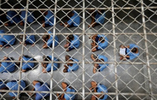 Inmates sit on the floor during an inspection  Thailand