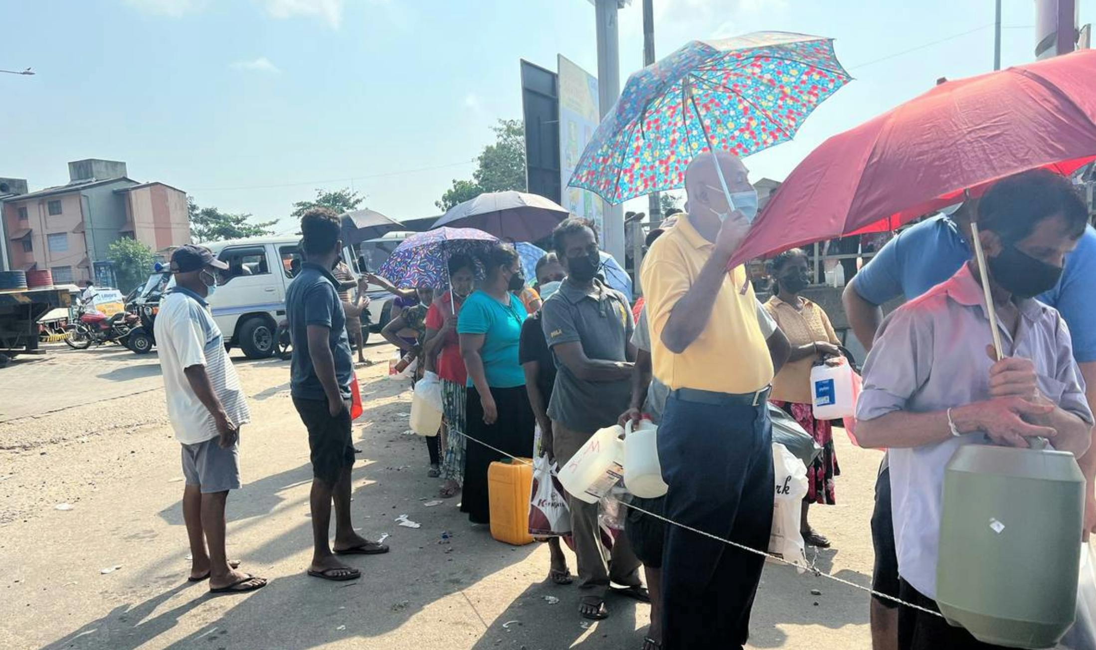 People wait in queue for kerosene oil in Colombo, Sri Lanka