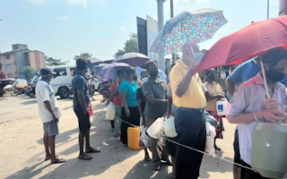 People wait in queue for kerosene oil in Colombo, Sri Lanka