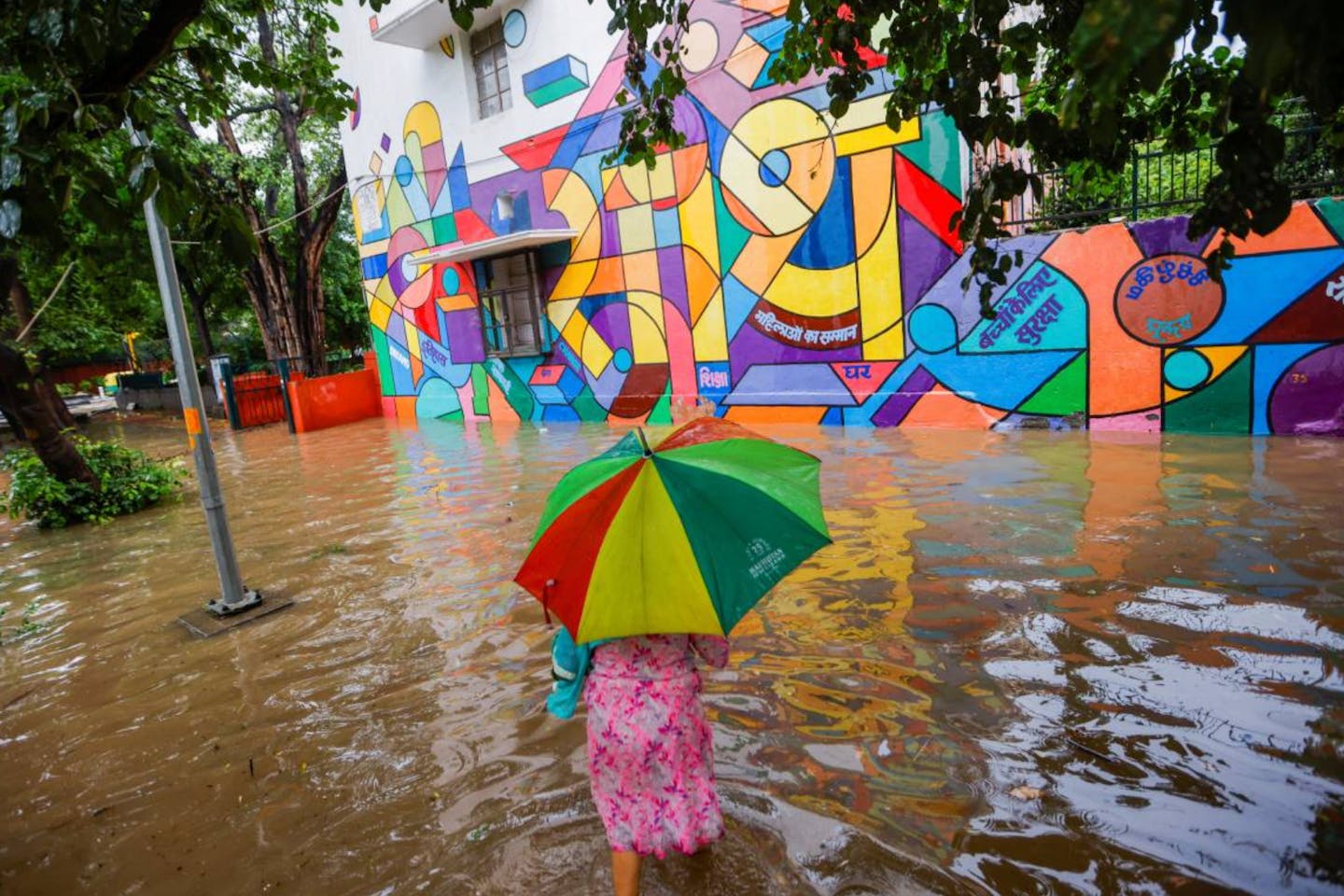 Woman walking through flooded street