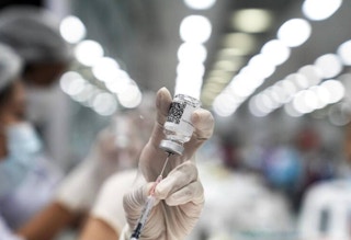 Vaccine dose being prepared in Thailand