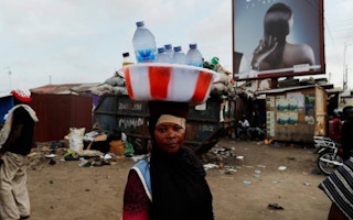 Woman street vendor selling water