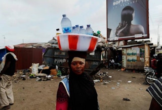 Woman street vendor selling water