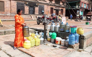 villager waiting for water in nepal