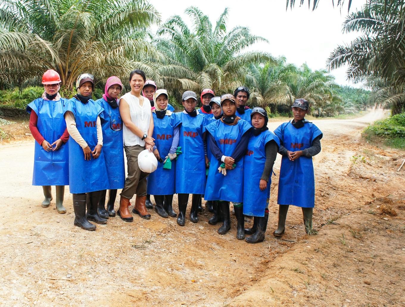 Cherie Tan with palm oil workers in East Kalimantan, Indonesia, in 2013. Image: Cherie Tan
