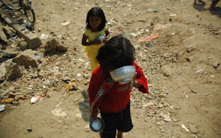 Children in India searching for food