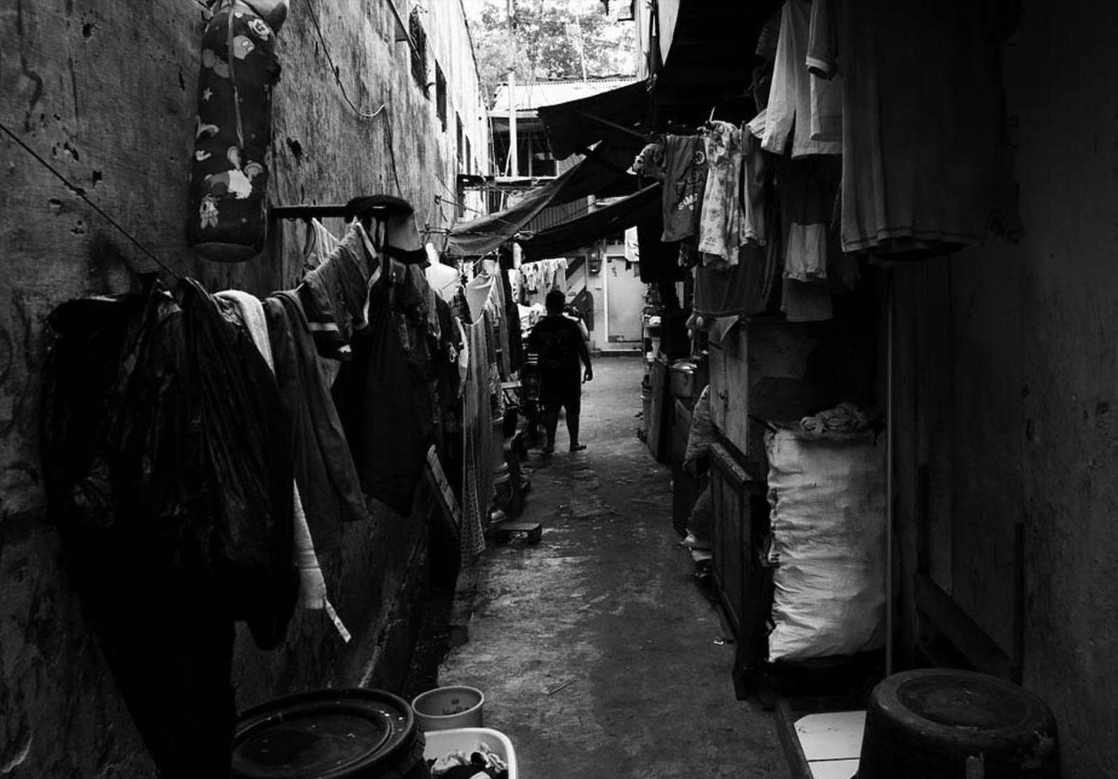Laundry lines stretch towards the back of this unmarked alley in Tanah Abang.