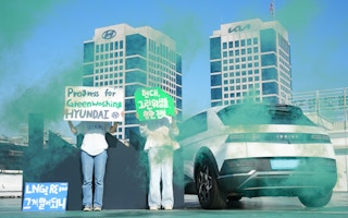 Activists protest outside of Hyundai manufacturing plant.