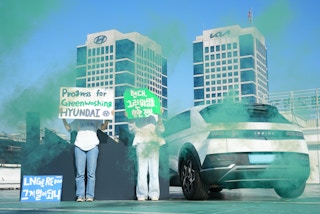 Activists protest outside of Hyundai manufacturing plant.