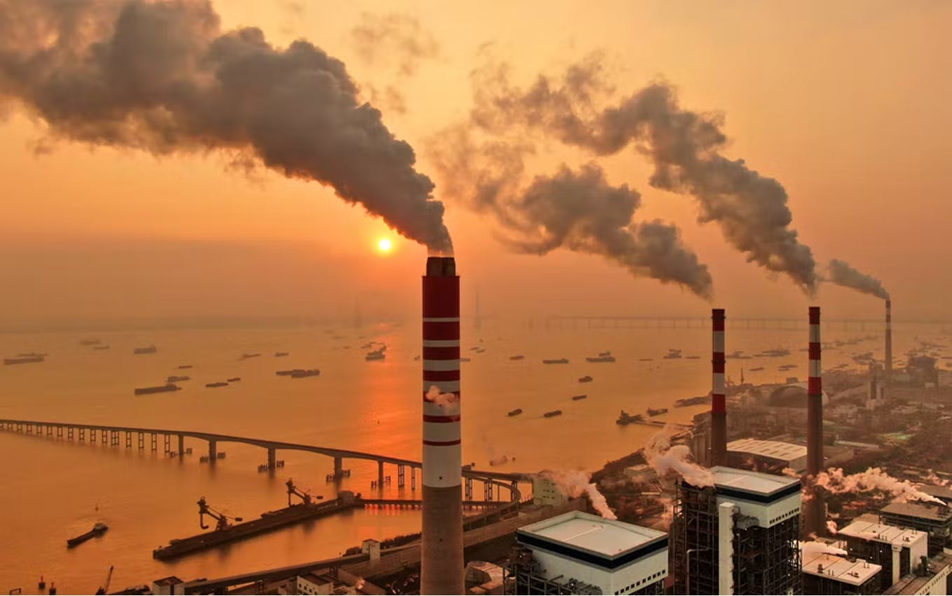 Smoke is discharged from chimneys at a coal-fired power plant in China